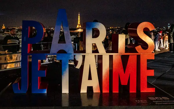 'Paris je t'aime' sign on Galeries Lafayette observation deck.